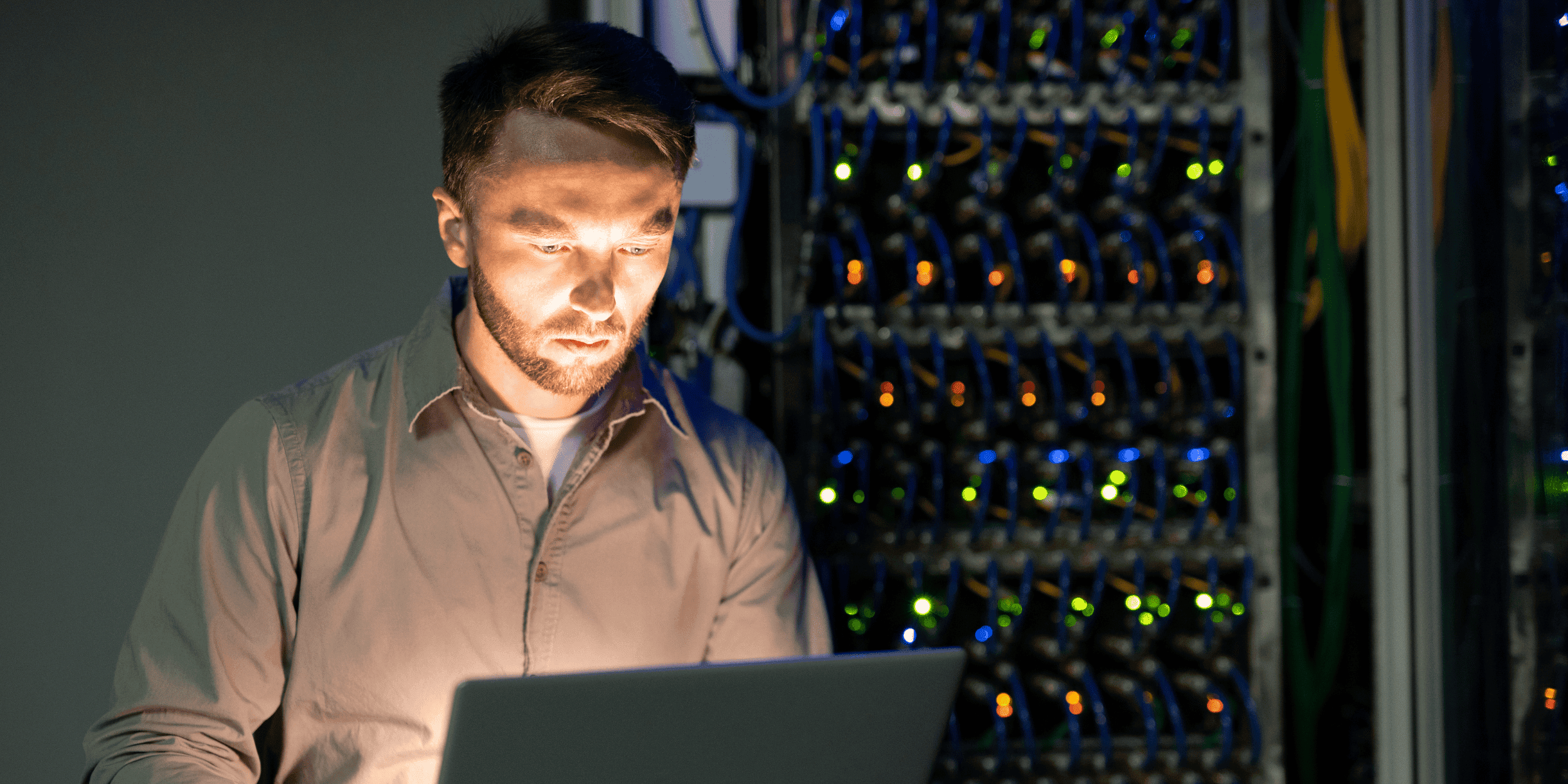 guy standing Infront of servers